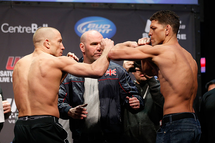 MONTREAL, QC - MARCH 15: Georges St-Pierre (L) and Nick Diaz (R) face off during the UFC 158 weigh-in at Bell Centre on March 15, 2013 in Montreal, Quebec, Canada.  (Photo by Josh Hedges/Zuffa LLC/Zuffa LLC via Getty Images)