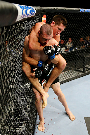 NEWARK, NJ - APRIL 27:  Steven Siler (top) battles against Kurt Holobaugh (bottom) in their featherweight bout during the UFC 159 event at the Prudential Center on April 27, 2013 in Newark, New Jersey.  (Photo by Al Bello/Zuffa LLC/Zuffa LLC Via Getty Images)