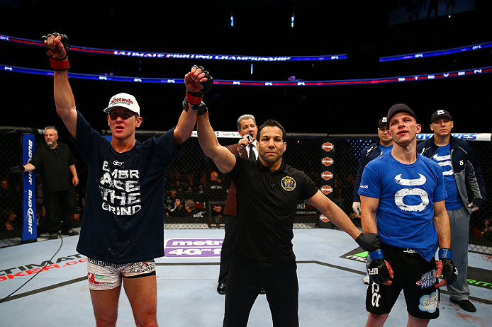 NEWARK, NJ - APRIL 27:  Steven Siler (L) is announced winner by unanimous decision in his featherweight bout against Kurt Holobaugh (R) during the UFC 159 event at the Prudential Center on April 27, 2013 in Newark, New Jersey.  (Photo by Al Bello/Zuffa LLC/Zuffa LLC Via Getty Images)