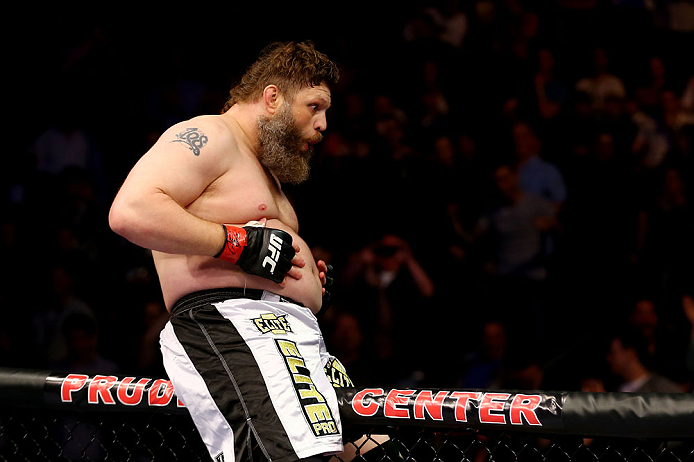 NEWARK, NJ - APRIL 27:  Roy Nelson sits on the side of the octagon in celebration of his win by knockout against Cheick Kongo of France in their heavyweight bout during the UFC 159 event at the Prudential Center on April 27, 2013 in Newark, New Jersey.  (Photo by Al Bello/Zuffa LLC/Zuffa LLC Via Getty Images)