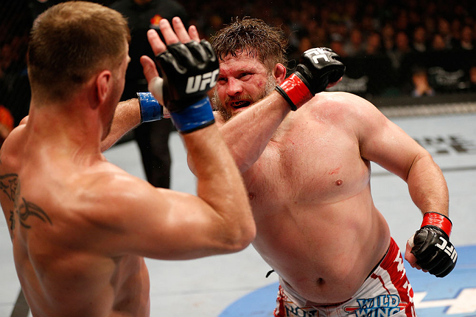 WINNIPEG, CANADA - JUNE 15:  (R-L) "Big Country" Roy Nelson punches Stipe Miocic in their heavyweight fight during the UFC 161 event at the MTS Centre on June 15, 2013 in Winnipeg, Manitoba, Canada.  (Photo by Josh Hedges/Zuffa LLC/Zuffa LLC via Getty Images)