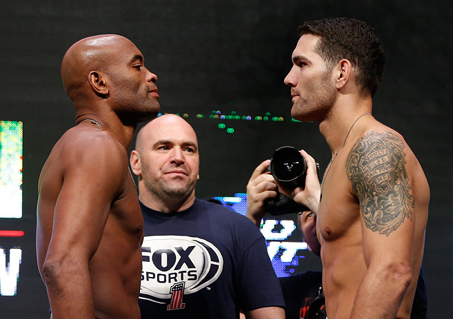 LAS VEGAS, NV - JULY 05:  (L-R) Opponents Anderson Silva and Chris Weidman face off during the UFC 162 weigh-in at the Mandalay Bay Events Center on July 5, 2013 in Las Vegas, Nevada.  (Photo by Josh Hedges/Zuffa LLC/Zuffa LLC via Getty Images)