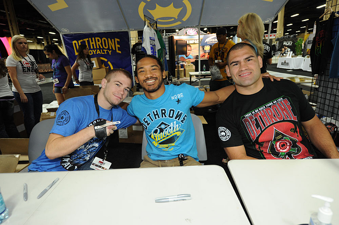 LAS VEGAS, NV - JULY 06:  (L-R) Michael McDonald, Benson Henderson and Cain Velasquez pose for fans at the UFC Fan Expo on July 6, 2012 in Las Vegas, Nevada. (Photo by Al Powers /Zuffa LLC/Zuffa LLC via Getty Images)