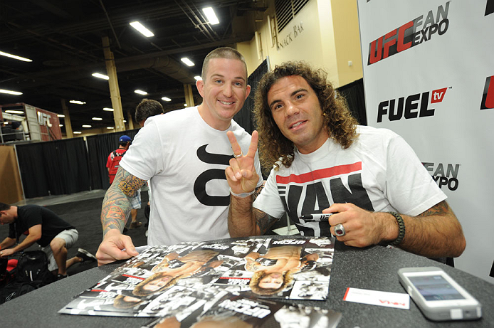 LAS VEGAS, NV - JULY 06:  Clay Guida poses with a fan at the UFC Fan Expo on July 6, 2012 in Las Vegas, Nevada. (Photo by Al Powers /Zuffa LLC/Zuffa LLC via Getty Images)