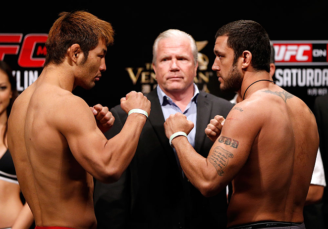 MACAU, MACAU - NOVEMBER 09:  (L-R) Opponents Riki Fukuda and Tom DeBlass face off during the UFC Macau weigh in at Cotai Arena on November 9, 2012 in Macau, Macau.  (Photo by Josh Hedges/Zuffa LLC/Zuffa LLC via Getty Images)