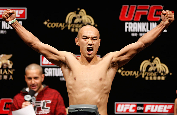 MACAU, MACAU - NOVEMBER 09:  Tiequan Zhang makes weight during the UFC Macau weigh in at Cotai Arena on November 9, 2012 in Macau, Macau.  (Photo by Josh Hedges/Zuffa LLC/Zuffa LLC via Getty Images)