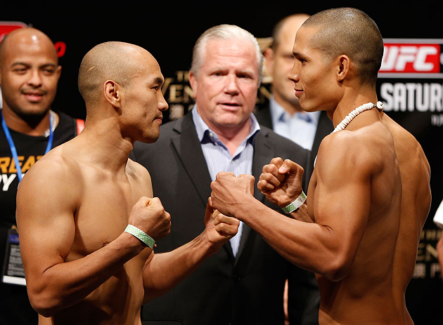 MACAU, MACAU - NOVEMBER 09:  (L-R) Opponents Tiequan Zhang and Jon Tuck face off during the UFC Macau weigh in at Cotai Arena on November 9, 2012 in Macau, Macau.  (Photo by Josh Hedges/Zuffa LLC/Zuffa LLC via Getty Images)