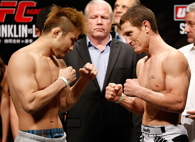 MACAU, MACAU - NOVEMBER 09:  (L-R) Opponents Takanori Gomi and Mac Danzig face off during the UFC Macau weigh in at Cotai Arena on November 9, 2012 in Macau, Macau.  (Photo by Josh Hedges/Zuffa LLC/Zuffa LLC via Getty Images)