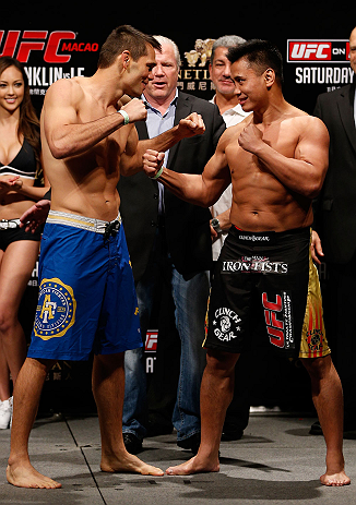 MACAU, MACAU - NOVEMBER 09:  (L-R) Opponents Rich Franklin and Cung Le face off during the UFC Macau weigh in at Cotai Arena on November 9, 2012 in Macau, Macau.  (Photo by Josh Hedges/Zuffa LLC/Zuffa LLC via Getty Images)