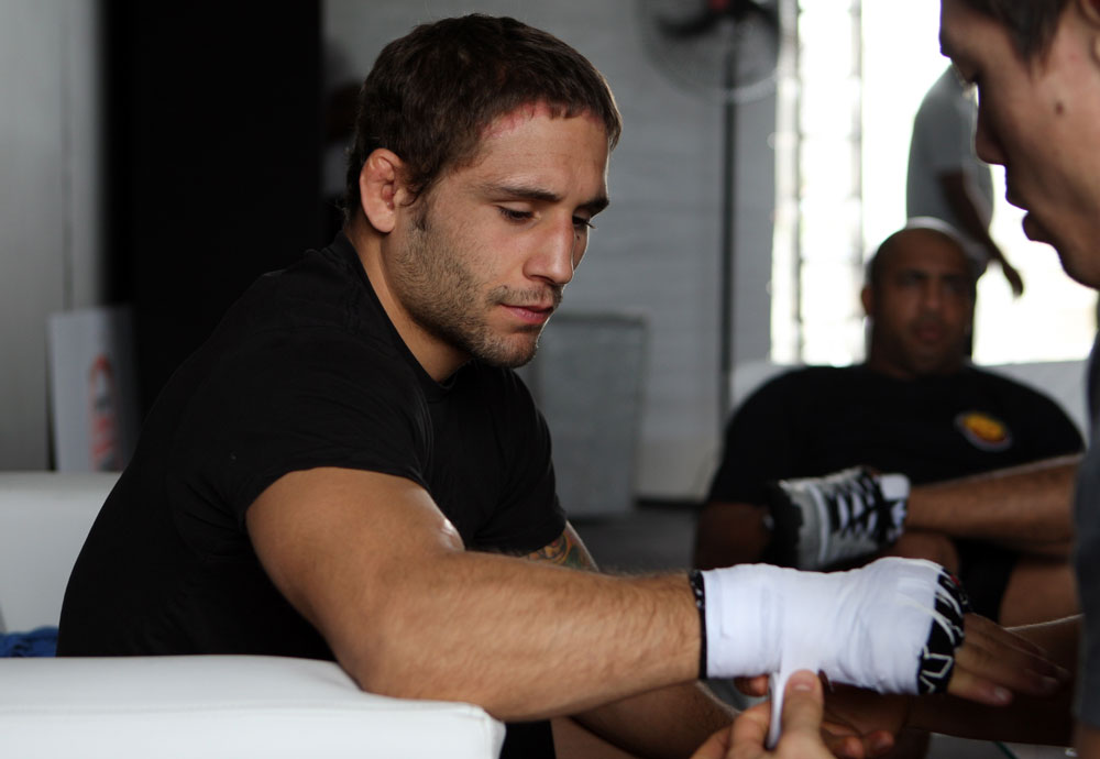 RIO DE JANEIRO, BRAZIL - JANUARY 11:  Chad Mendes has his hands wrapped before the UFC 142 Open Workouts at Barra de Tijuca Beach on January 11, 2012 in Rio de Janeiro, Brazil.  (Photo by Josh Hedges/Zuffa LLC/Zuffa LLC via Getty Images)