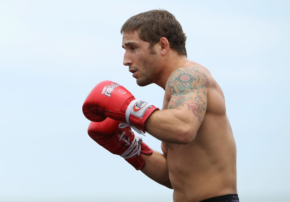 RIO DE JANEIRO, BRAZIL - JANUARY 11:  Chad Mendes works out for the media and fans during the UFC 142 Open Workouts at Barra de Tijuca Beach on January 11, 2012 in Rio de Janeiro, Brazil.  (Photo by Josh Hedges/Zuffa LLC/Zuffa LLC via Getty Images)