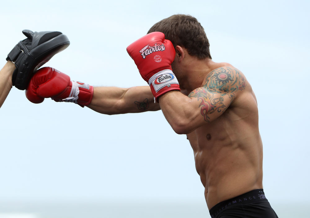 RIO DE JANEIRO, BRAZIL - JANUARY 11:  Chad Mendes works out for the media and fans during the UFC 142 Open Workouts at Barra de Tijuca Beach on January 11, 2012 in Rio de Janeiro, Brazil.  (Photo by Josh Hedges/Zuffa LLC/Zuffa LLC via Getty Images)
