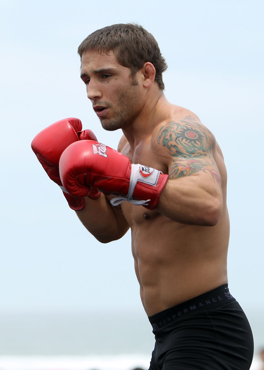 RIO DE JANEIRO, BRAZIL - JANUARY 11:  Chad Mendes works out for the media and fans during the UFC 142 Open Workouts at Barra de Tijuca Beach on January 11, 2012 in Rio de Janeiro, Brazil.  (Photo by Josh Hedges/Zuffa LLC/Zuffa LLC via Getty Images)