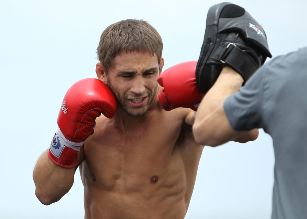 RIO DE JANEIRO, BRAZIL - JANUARY 11:  Chad Mendes works out for the media and fans during the UFC 142 Open Workouts at Barra de Tijuca Beach on January 11, 2012 in Rio de Janeiro, Brazil.  (Photo by Josh Hedges/Zuffa LLC/Zuffa LLC via Getty Images)