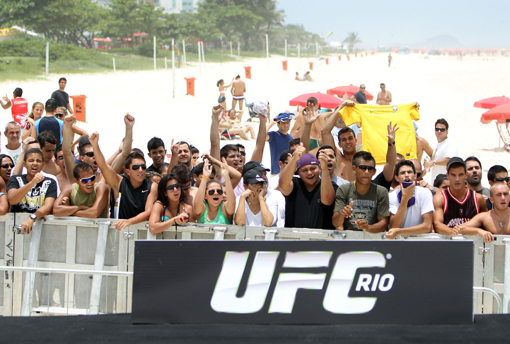 RIO DE JANEIRO, BRAZIL - JANUARY 11:  Fans react during the UFC 142 Open Workouts at Barra de Tijuca Beach on January 11, 2012 in Rio de Janeiro, Brazil.  (Photo by Josh Hedges/Zuffa LLC/Zuffa LLC via Getty Images)