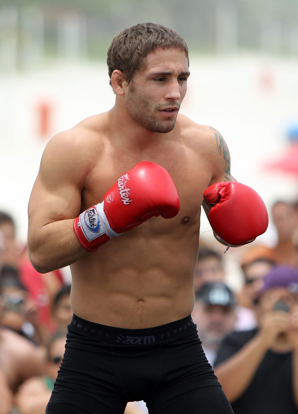RIO DE JANEIRO, BRAZIL - JANUARY 11:  Chad Mendes works out for the media and fans during the UFC 142 Open Workouts at Barra de Tijuca Beach on January 11, 2012 in Rio de Janeiro, Brazil.  (Photo by Josh Hedges/Zuffa LLC/Zuffa LLC via Getty Images)