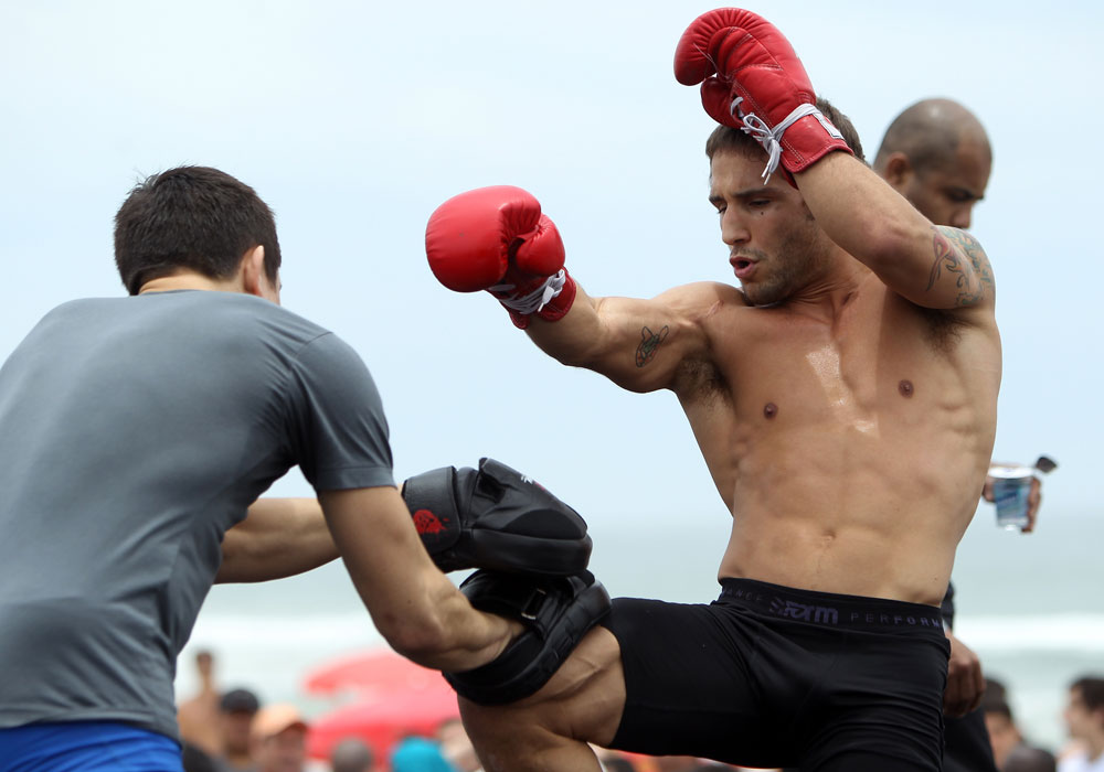 RIO DE JANEIRO, BRAZIL - JANUARY 11:  Chad Mendes works out for the media and fans during the UFC 142 Open Workouts at Barra de Tijuca Beach on January 11, 2012 in Rio de Janeiro, Brazil.  (Photo by Josh Hedges/Zuffa LLC/Zuffa LLC via Getty Images)
