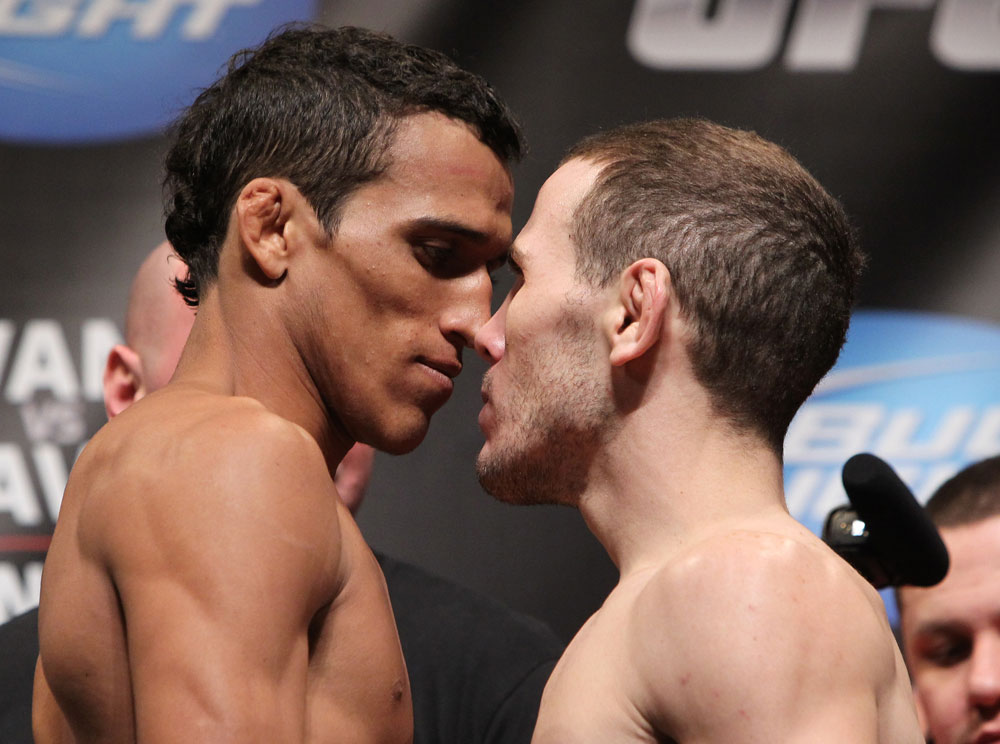 CHICAGO, IL - JANUARY 27: (L-R) Featherweight opponents Charles Oliveira and Eric Wisely face off after weighing in during the UFC on FOX official weigh in at the Chicago Theatre on January 27, 2012 in Chicago, Illinois. (Photo by Josh Hedges/Zuffa LLC/Zuffa LLC via Getty Images) *** Local Caption *** Charles Oliveira; Eric Wisely
