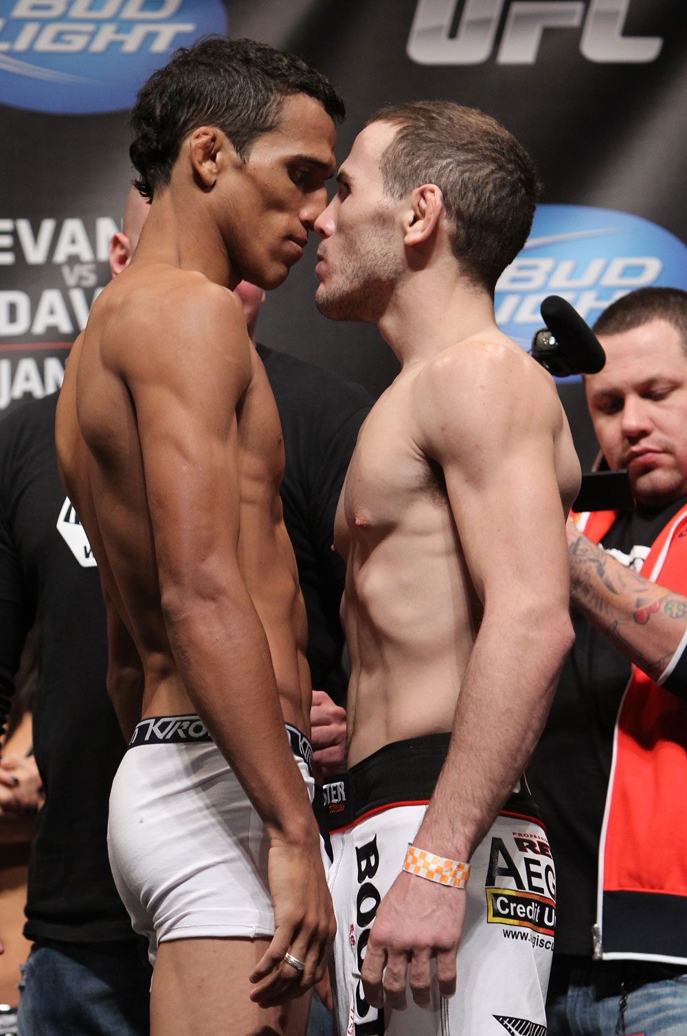 CHICAGO, IL - JANUARY 27: (L-R) Featherweight opponents Charles Oliveira and Eric Wisely face off after weighing in during the UFC on FOX official weigh in at the Chicago Theatre on January 27, 2012 in Chicago, Illinois. (Photo by Josh Hedges/Zuffa LLC/Zuffa LLC via Getty Images) *** Local Caption *** Charles Oliveira; Eric Wisely