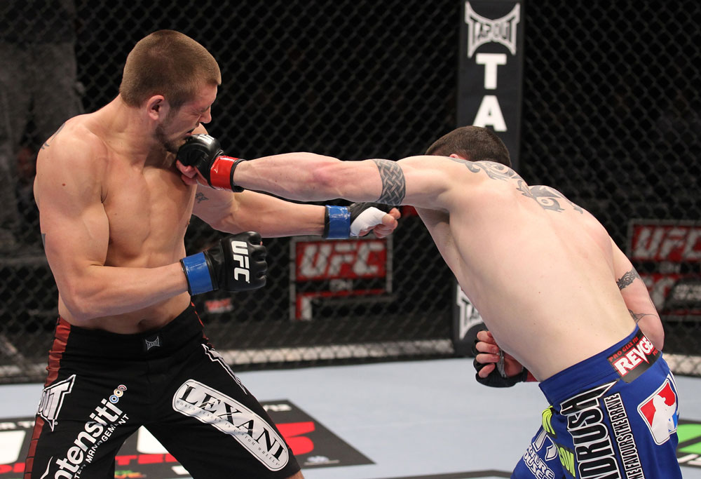 CHICAGO, IL - JANUARY 28:  (R-L) Chris Camozzi punches Dustin Jacoby during the UFC on FOX event at United Center on January 28, 2012 in Chicago, Illinois.  (Photo by Nick Laham/Zuffa LLC/Zuffa LLC via Getty Images) *** Local Caption *** Chris Camozzi; Dustin Jacoby