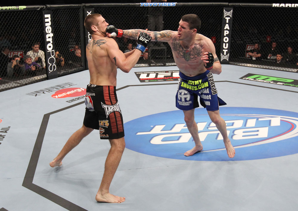 CHICAGO, IL - JANUARY 28:  (R-L) Chris Camozzi punches Dustin Jacoby during the UFC on FOX event at United Center on January 28, 2012 in Chicago, Illinois.  (Photo by Nick Laham/Zuffa LLC/Zuffa LLC via Getty Images) *** Local Caption *** Chris Camozzi; Dustin Jacoby