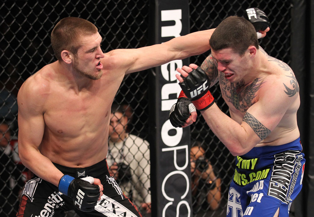 CHICAGO, IL - JANUARY 28:  (L-R) Dustin Jacoby punches Chris Camozzi during the UFC on FOX event at United Center on January 28, 2012 in Chicago, Illinois.  (Photo by Nick Laham/Zuffa LLC/Zuffa LLC via Getty Images) *** Local Caption *** Chris Camozzi; Dustin Jacoby