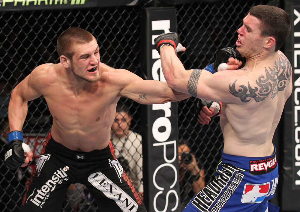 CHICAGO, IL - JANUARY 28:  (L-R) Dustin Jacoby punches Chris Camozzi during the UFC on FOX event at United Center on January 28, 2012 in Chicago, Illinois.  (Photo by Nick Laham/Zuffa LLC/Zuffa LLC via Getty Images) *** Local Caption *** Chris Camozzi; Dustin Jacoby