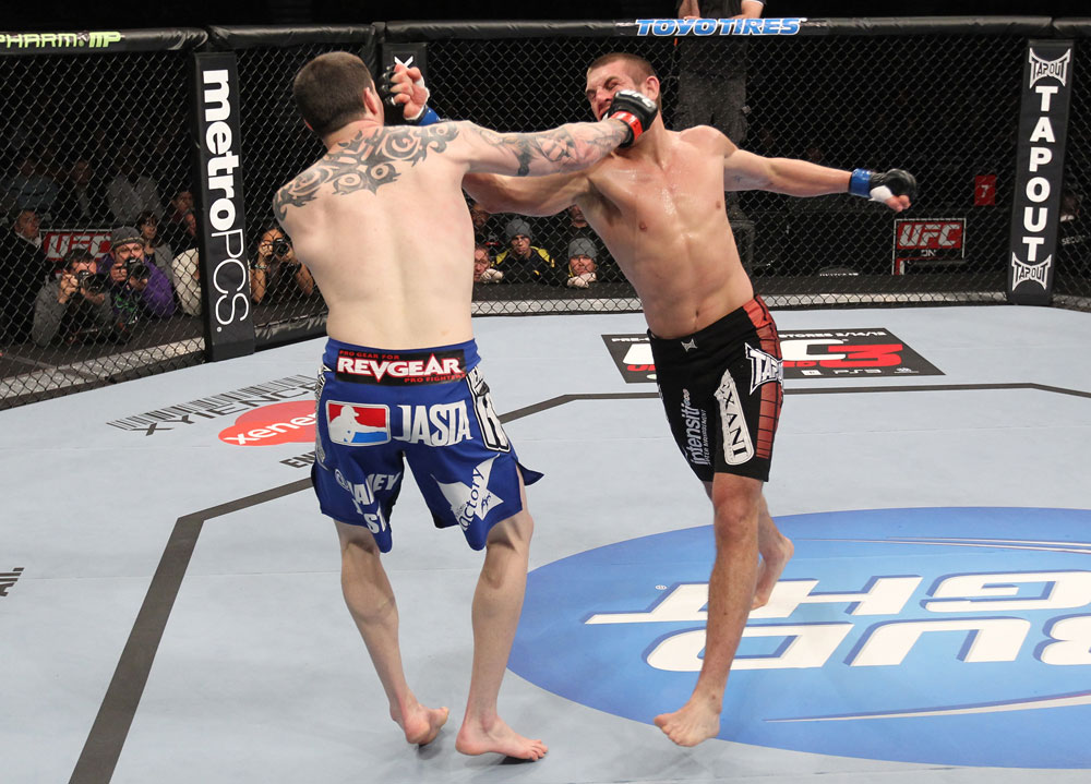 CHICAGO, IL - JANUARY 28:  (R-L) Dustin Jacoby and Chris Camozzi trade punches during the UFC on FOX event at United Center on January 28, 2012 in Chicago, Illinois.  (Photo by Nick Laham/Zuffa LLC/Zuffa LLC via Getty Images) *** Local Caption *** Chris Camozzi; Dustin Jacoby