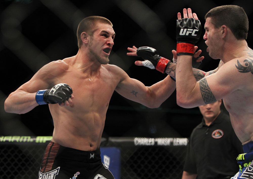 CHICAGO, IL - JANUARY 28:  (L-R) Dustin Jacoby punches Chris Camozzi during the UFC on FOX event at United Center on January 28, 2012 in Chicago, Illinois.  (Photo by Josh Hedges/Zuffa LLC/Zuffa LLC via Getty Images) *** Local Caption *** Chris Camozzi; Dustin Jacoby