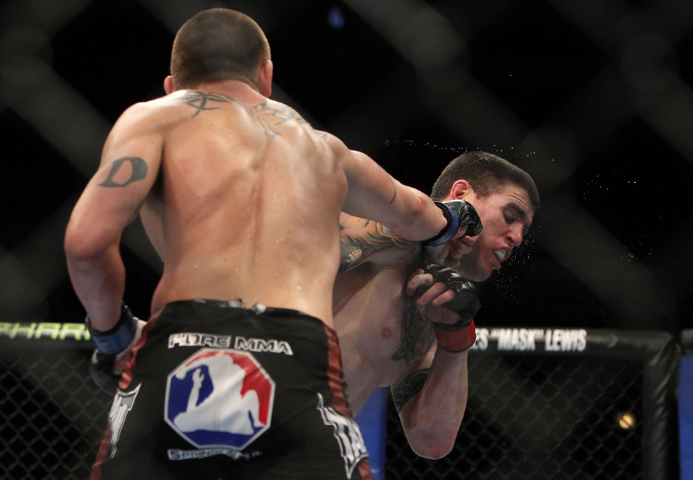 CHICAGO, IL - JANUARY 28:  (L-R) Dustin Jacoby punches Chris Camozzi during the UFC on FOX event at United Center on January 28, 2012 in Chicago, Illinois.  (Photo by Josh Hedges/Zuffa LLC/Zuffa LLC via Getty Images) *** Local Caption *** Chris Camozzi; Dustin Jacoby