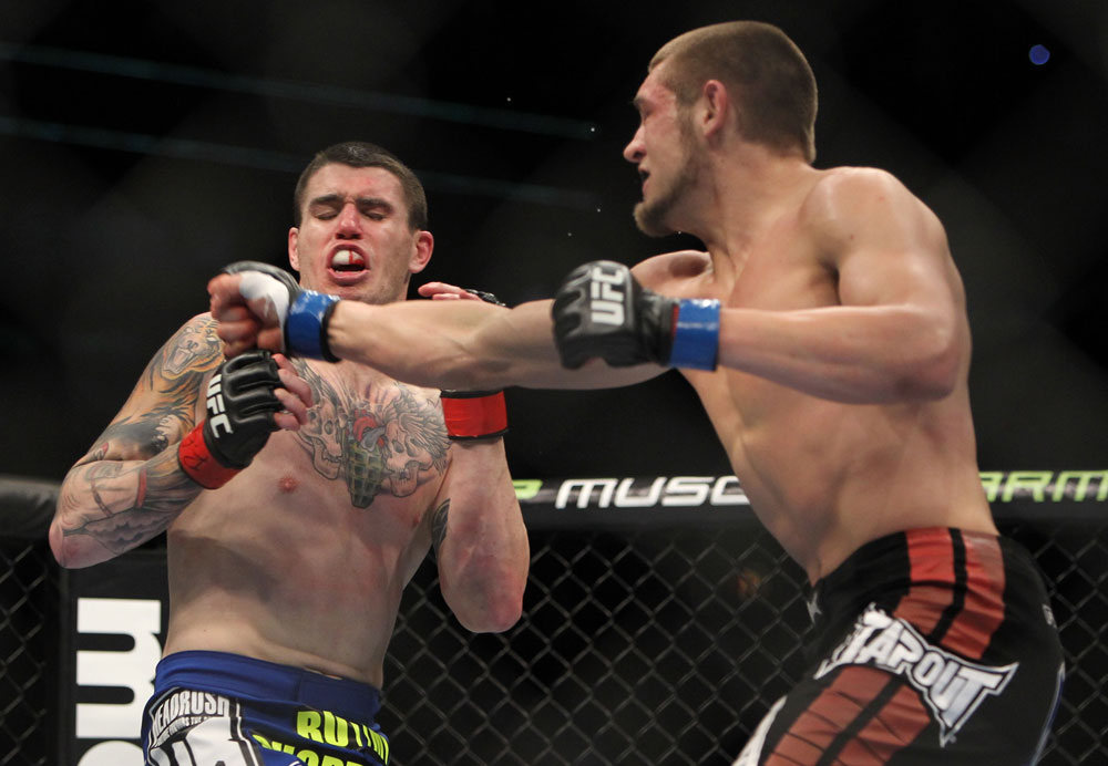 CHICAGO, IL - JANUARY 28:  (R-L) Dustin Jacoby punches Chris Camozzi during the UFC on FOX event at United Center on January 28, 2012 in Chicago, Illinois.  (Photo by Josh Hedges/Zuffa LLC/Zuffa LLC via Getty Images) *** Local Caption *** Chris Camozzi; Dustin Jacoby