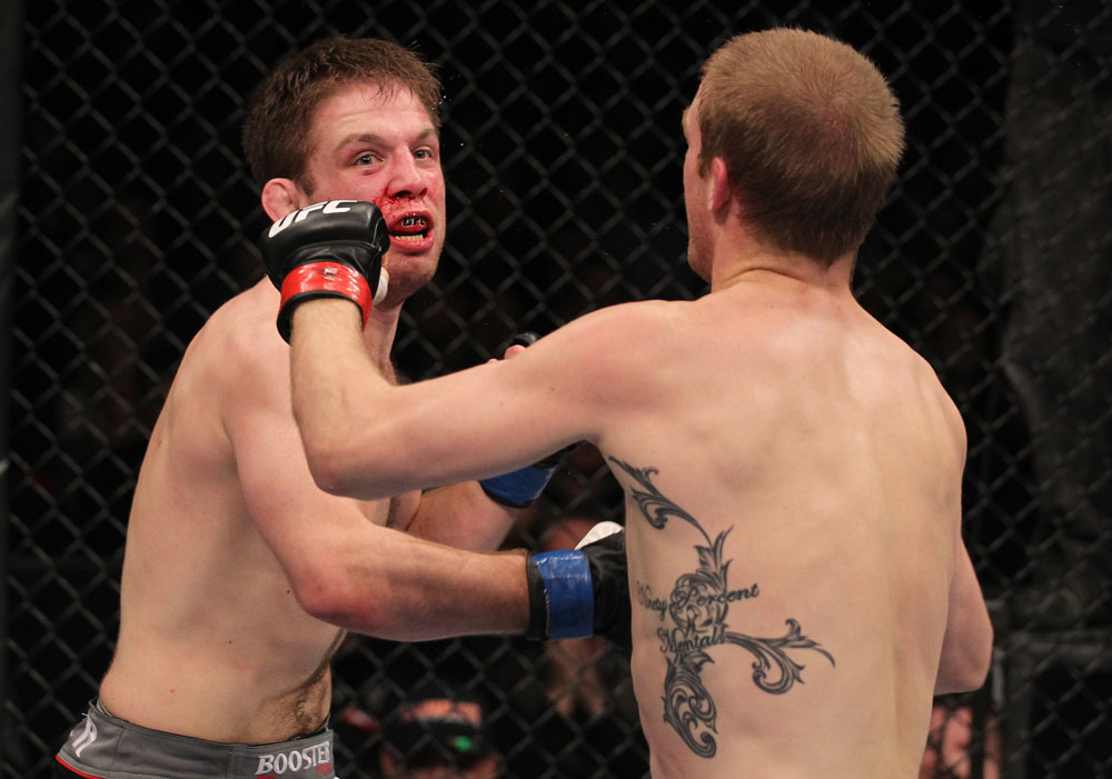 CHICAGO, IL - JANUARY 28:  (L-R) Nik Lentz punches Evan Dunham during the UFC on FOX event at United Center on January 28, 2012 in Chicago, Illinois.  (Photo by Nick Laham/Zuffa LLC/Zuffa LLC via Getty Images) *** Local Caption *** Nik Lentz; Evan Dunham