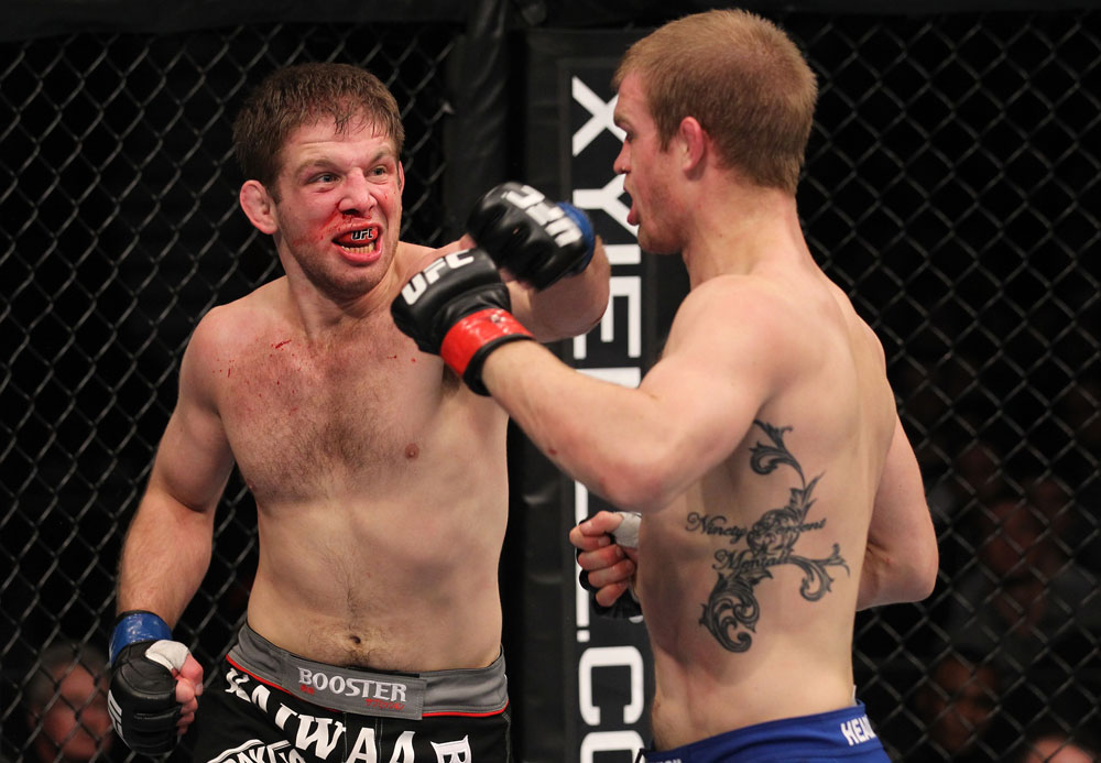 CHICAGO, IL - JANUARY 28:  (L-R) Nik Lentz punches Evan Dunham during the UFC on FOX event at United Center on January 28, 2012 in Chicago, Illinois.  (Photo by Nick Laham/Zuffa LLC/Zuffa LLC via Getty Images) *** Local Caption *** Nik Lentz; Evan Dunham