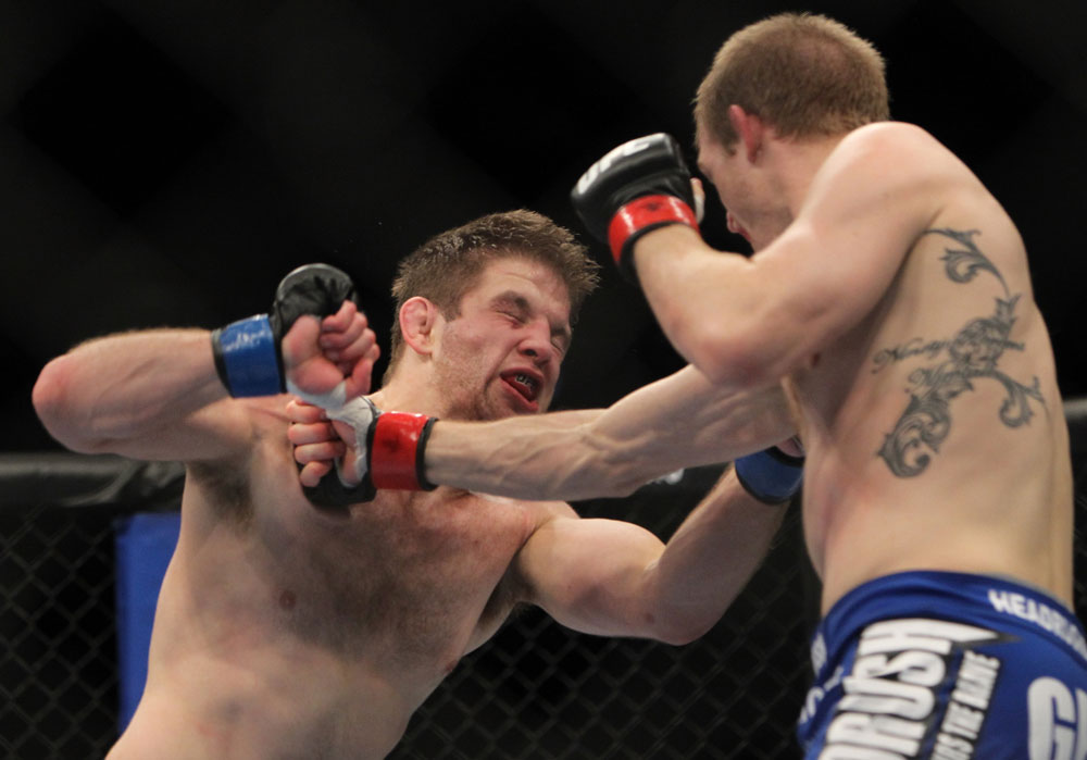 CHICAGO, IL - JANUARY 28:  (R-L) Evan Dunham punches Nik Lentz during the UFC on FOX event at United Center on January 28, 2012 in Chicago, Illinois.  (Photo by Josh Hedges/Zuffa LLC/Zuffa LLC via Getty Images) *** Local Caption *** Nik Lentz; Evan Dunham
