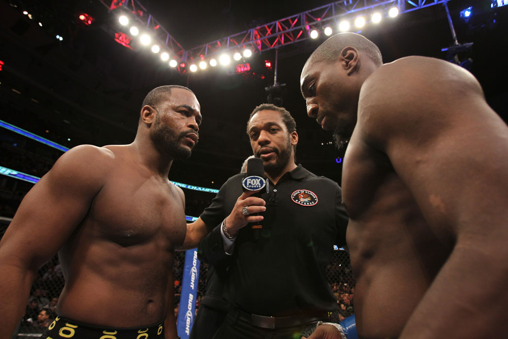 CHICAGO, IL - JANUARY 28:  (L-R) Light Heavyweight opponents Rashad Evans and Phil Davis receive final instructions from referee Herb Dean before their bout during the UFC on FOX event at United Center on January 28, 2012 in Chicago, Illinois.  (Photo by Josh Hedges/Zuffa LLC/Zuffa LLC via Getty Images) *** Local Caption *** Rashad Evans; Phil Davis; Herb Dean