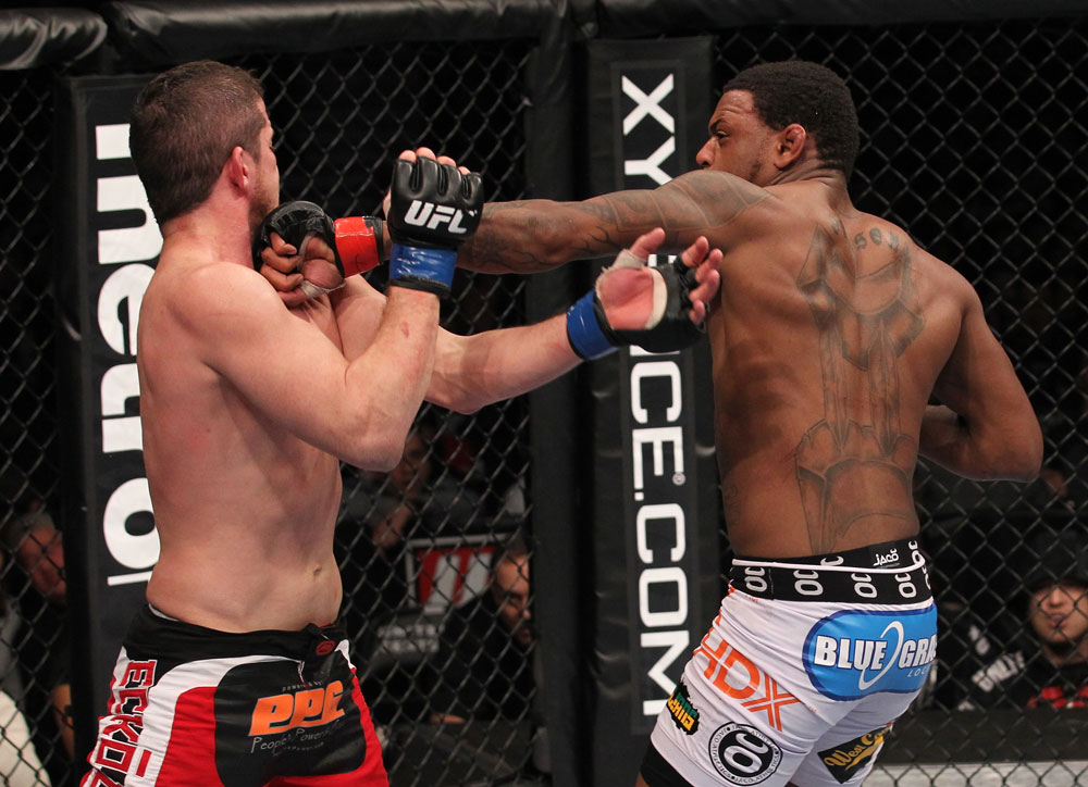 CHICAGO, IL - JANUARY 28:  (R-L) Michael Johnson punches Shane Roller during the UFC on FOX event at United Center on January 28, 2012 in Chicago, Illinois.  (Photo by Nick Laham/Zuffa LLC/Zuffa LLC via Getty Images) *** Local Caption *** Michael Johnson; Shane Roller