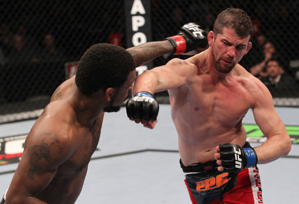 CHICAGO, IL - JANUARY 28:  (L-R) Michael Johnson and Shane Roller trade punches during the UFC on FOX event at United Center on January 28, 2012 in Chicago, Illinois.  (Photo by Nick Laham/Zuffa LLC/Zuffa LLC via Getty Images) *** Local Caption *** Michael Johnson; Shane Roller