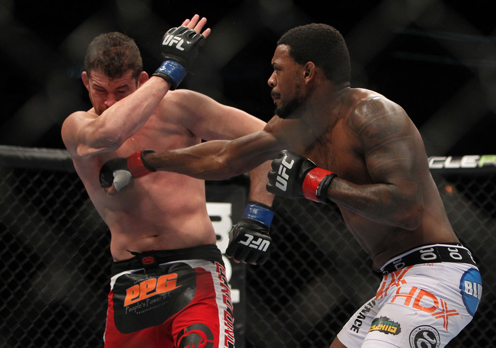 CHICAGO, IL - JANUARY 28:  (R-L) Michael Johnson punches Shane Roller during the UFC on FOX event at United Center on January 28, 2012 in Chicago, Illinois.  (Photo by Josh Hedges/Zuffa LLC/Zuffa LLC via Getty Images) *** Local Caption *** Michael Johnson; Shane Roller