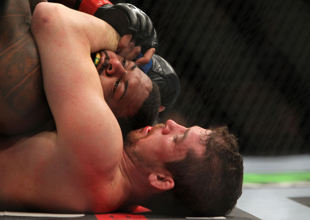 CHICAGO, IL - JANUARY 28:  (R-L) Shane Roller attempts a rear choke submission against Michael Johnson during the UFC on FOX event at United Center on January 28, 2012 in Chicago, Illinois.  (Photo by Josh Hedges/Zuffa LLC/Zuffa LLC via Getty Images) *** Local Caption *** Michael Johnson; Shane Roller