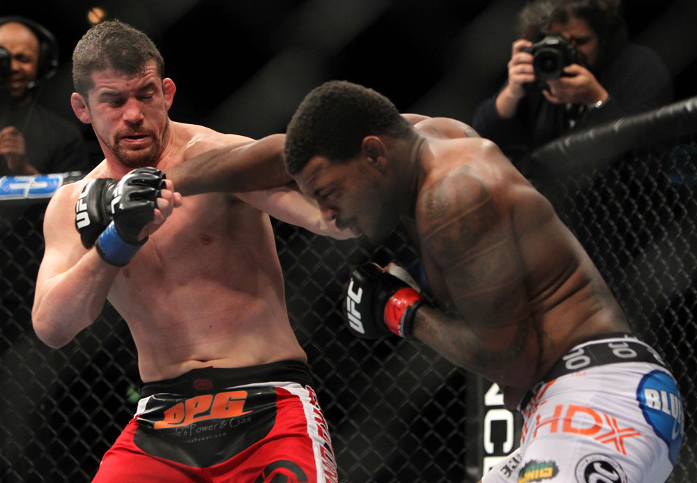 CHICAGO, IL - JANUARY 28:  (R-L) Michael Johnson and Shane Roller trade punches during the UFC on FOX event at United Center on January 28, 2012 in Chicago, Illinois.  (Photo by Josh Hedges/Zuffa LLC/Zuffa LLC via Getty Images) *** Local Caption *** Michael Johnson; Shane Roller