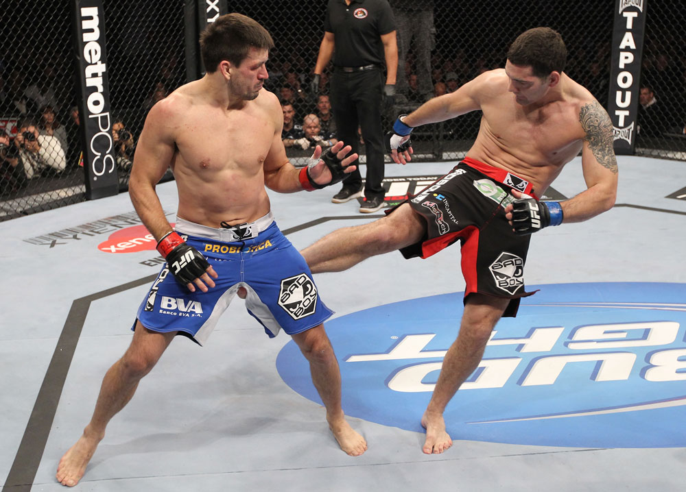 CHICAGO, IL - JANUARY 28:  (R-L) Chris Weidman kicks Demian Maia during the UFC on FOX event at United Center on January 28, 2012 in Chicago, Illinois.  (Photo by Nick Laham/Zuffa LLC/Zuffa LLC via Getty Images) *** Local Caption *** Chris Weidman; Demian Maia