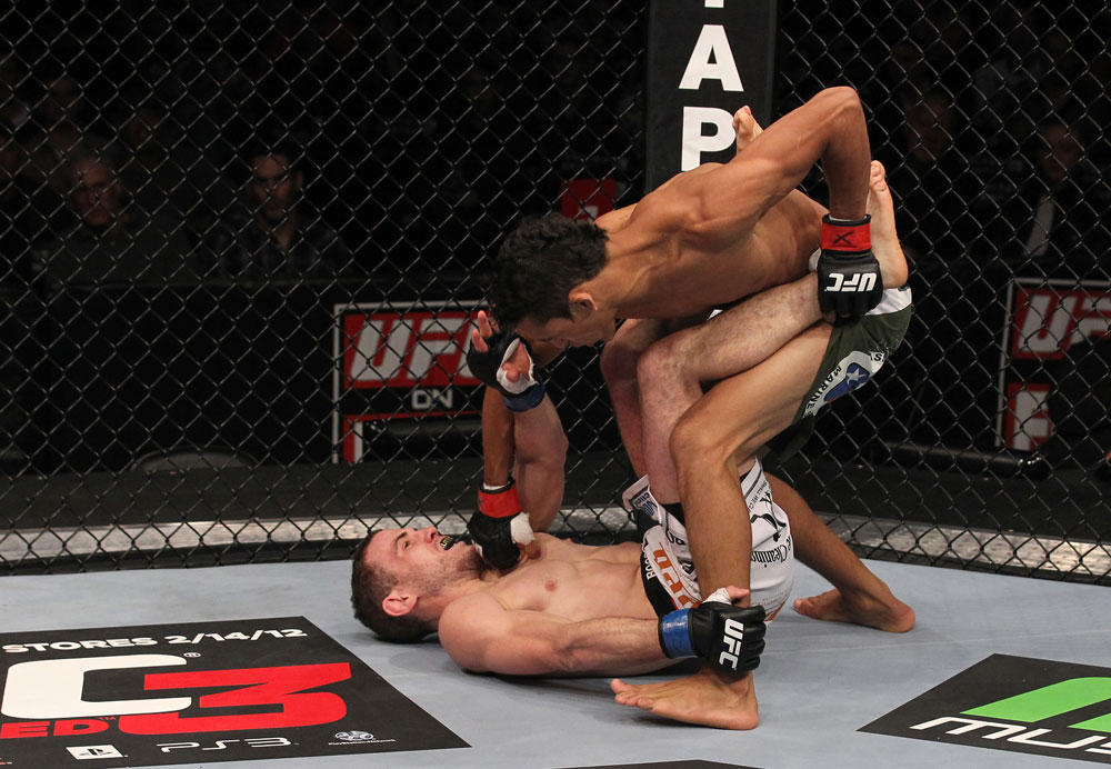 CHICAGO, IL - JANUARY 28:  (R-L) Charles Oliveira punches Eric Wisely during the UFC on FOX event at United Center on January 28, 2012 in Chicago, Illinois.  (Photo by Nick Laham/Zuffa LLC/Zuffa LLC via Getty Images) *** Local Caption *** Eric Wisely; Charles Oliveira