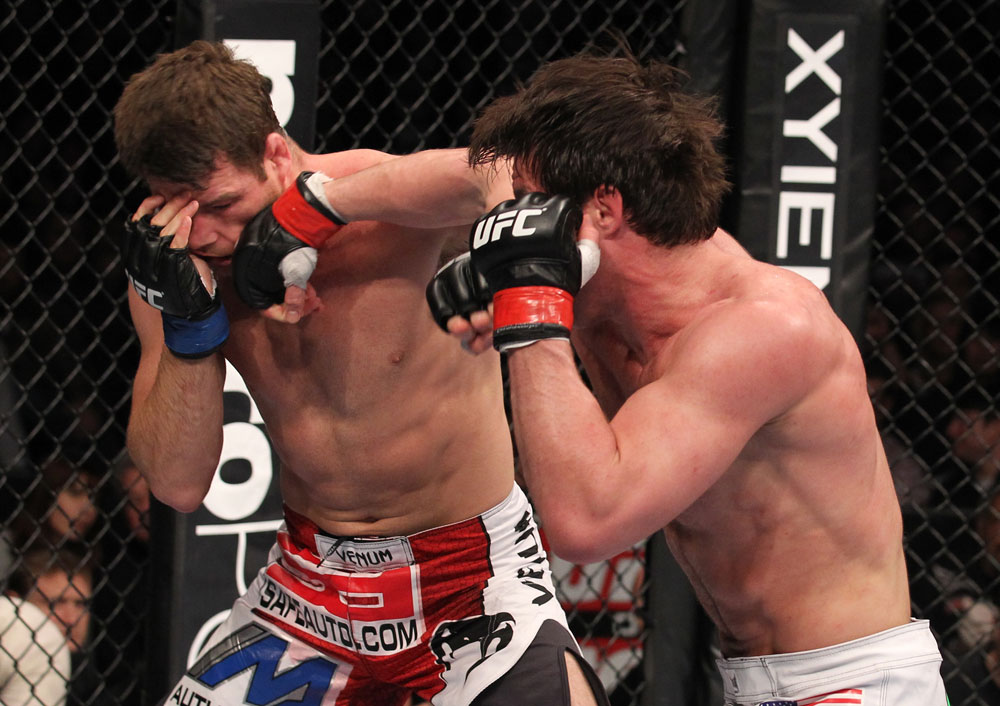 CHICAGO, IL - JANUARY 28:  (R-L) Chael Sonnen punches Michael Bisping during the UFC on FOX event at United Center on January 28, 2012 in Chicago, Illinois.  (Photo by Nick Laham/Zuffa LLC/Zuffa LLC via Getty Images) *** Local Caption *** Chael Sonnen; Michael Bisping