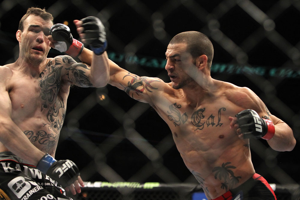 CHICAGO, IL - JANUARY 28:  (L-R) George Roop and Cub Swanson trade punches during the UFC on FOX event at United Center on January 28, 2012 in Chicago, Illinois.  (Photo by Josh Hedges/Zuffa LLC/Zuffa LLC via Getty Images) *** Local Caption *** Cub Swanson; George Roop