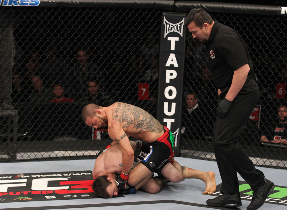 CHICAGO, IL - JANUARY 28:  (R-L) Cub Swanson defeats George Roop by TKO due to punches during the UFC on FOX event at United Center on January 28, 2012 in Chicago, Illinois.  (Photo by Nick Laham/Zuffa LLC/Zuffa LLC via Getty Images) *** Local Caption *** George Roop; Cub Swanson