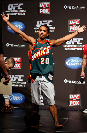 SEATTLE, WA - DECEMBER 07:  Benson Henderson stands on stage wearing a Gary Payton Seattle Sonics jersey during the official UFC on FOX weigh in on December 7, 2012 at Key Arena in Seattle, Washington.  (Photo by Josh Hedges/Zuffa LLC/Zuffa LLC via Getty Images)