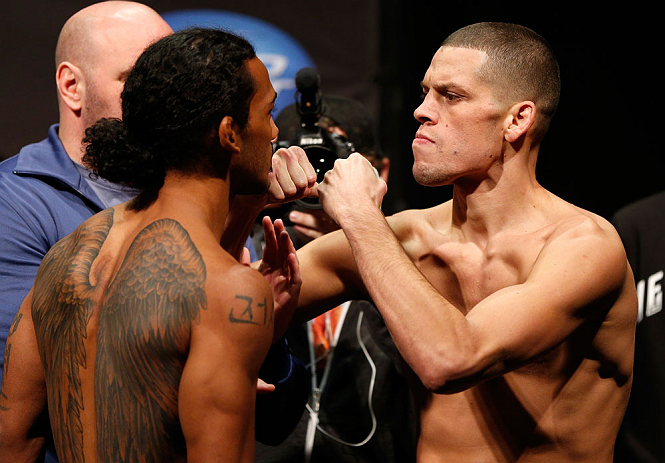 SEATTLE, WA - DECEMBER 07:  (L-R) Opponents Benson Henderson and Nate Diaz face off during the official UFC on FOX weigh in on December 7, 2012 at Key Arena in Seattle, Washington.  (Photo by Josh Hedges/Zuffa LLC/Zuffa LLC via Getty Images)