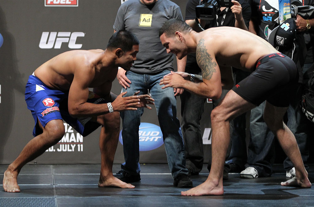 SAN JOSE, CA - JULY 10:   (L-R) Opponents Mark Munoz and Chris Weidman face off after making weight during the UFC on Fuel TV weigh in at HP Pavilion on July 10, 2012 in San Jose, California.  (Photo by Josh Hedges/Zuffa LLC/Zuffa LLC via Getty Images)