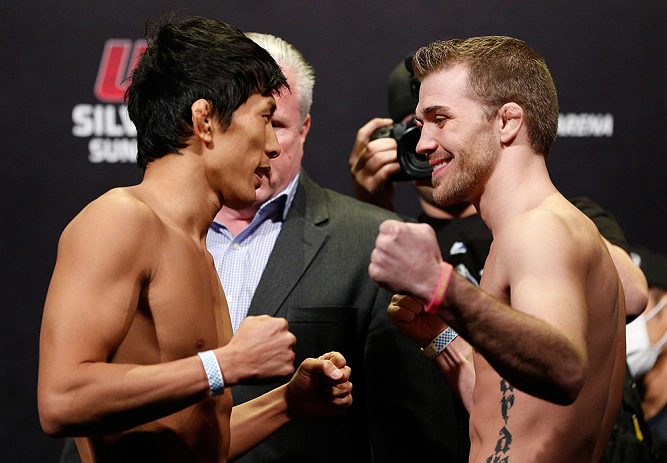 SAITAMA, JAPAN - MARCH 02: (L-R) Opponents Takeya Mizugaki and Bryan Caraway face off during the UFC on FUEL TV weigh-in at Saitama Super Arena on March 2, 2013 in Saitama, Japan. (Photo by Josh Hedges/Zuffa LLC/Zuffa LLC via Getty Images)