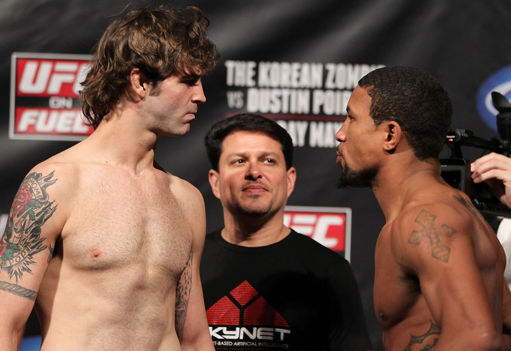FAIRFAX, VA - MAY 14: (L-R) Lightweight opponents Cody McKenzie and Marcus LeVesseure face off after weighing during the UFC on Fuel TV official weigh in at Patriot Center on May 14, 2012 in Fairfax, Virginia. (Photo by Josh Hedges/Zuffa LLC/Zuffa LLC via Getty Images)